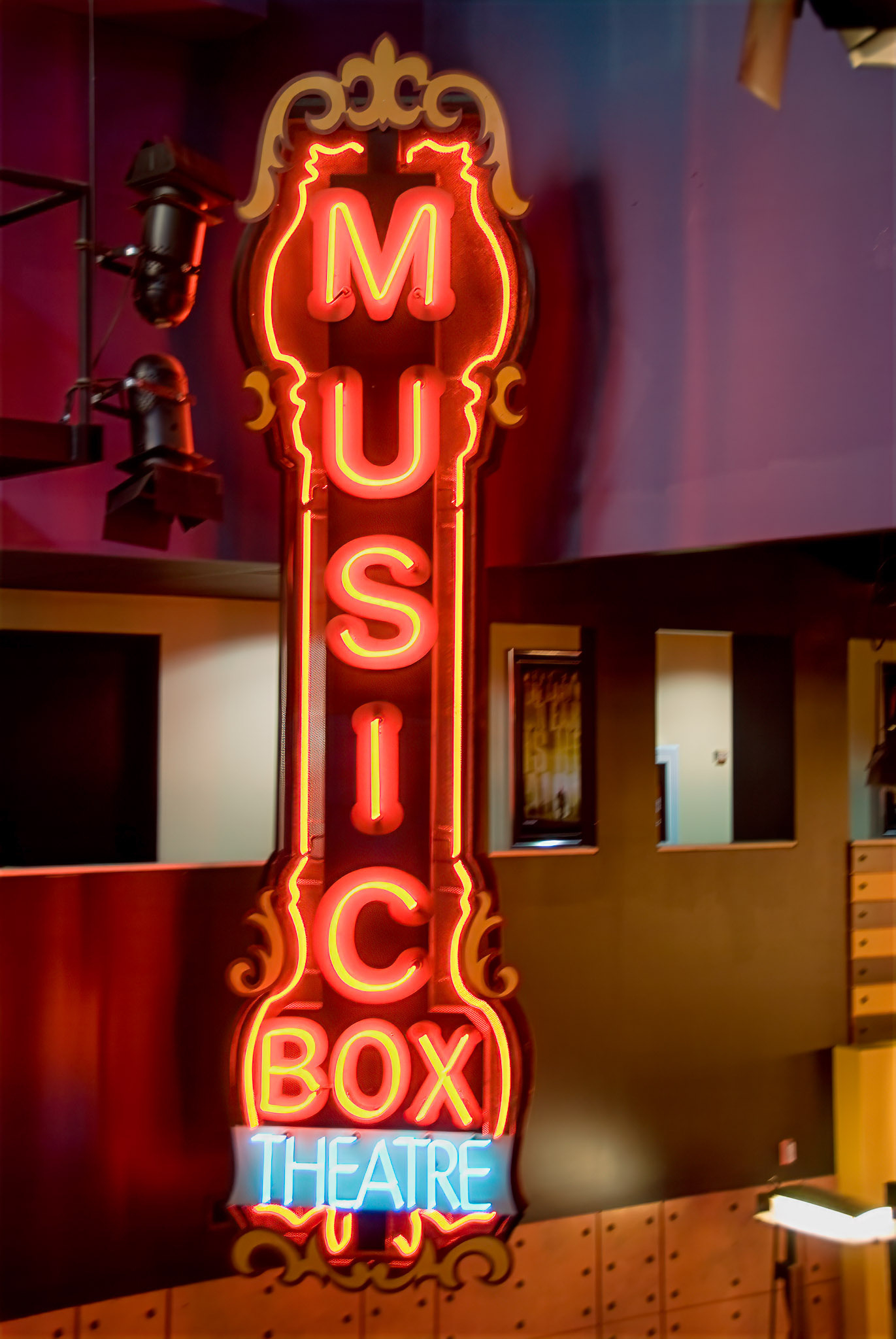 A vintage-style neon sign reads Music Box Theatre and is lit up in red and blue.